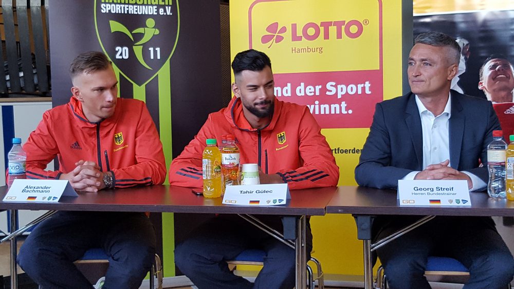 Die Weltmeister Alexander Bachmann und Tahir Gülec mit Bundestrainer Georg Streif